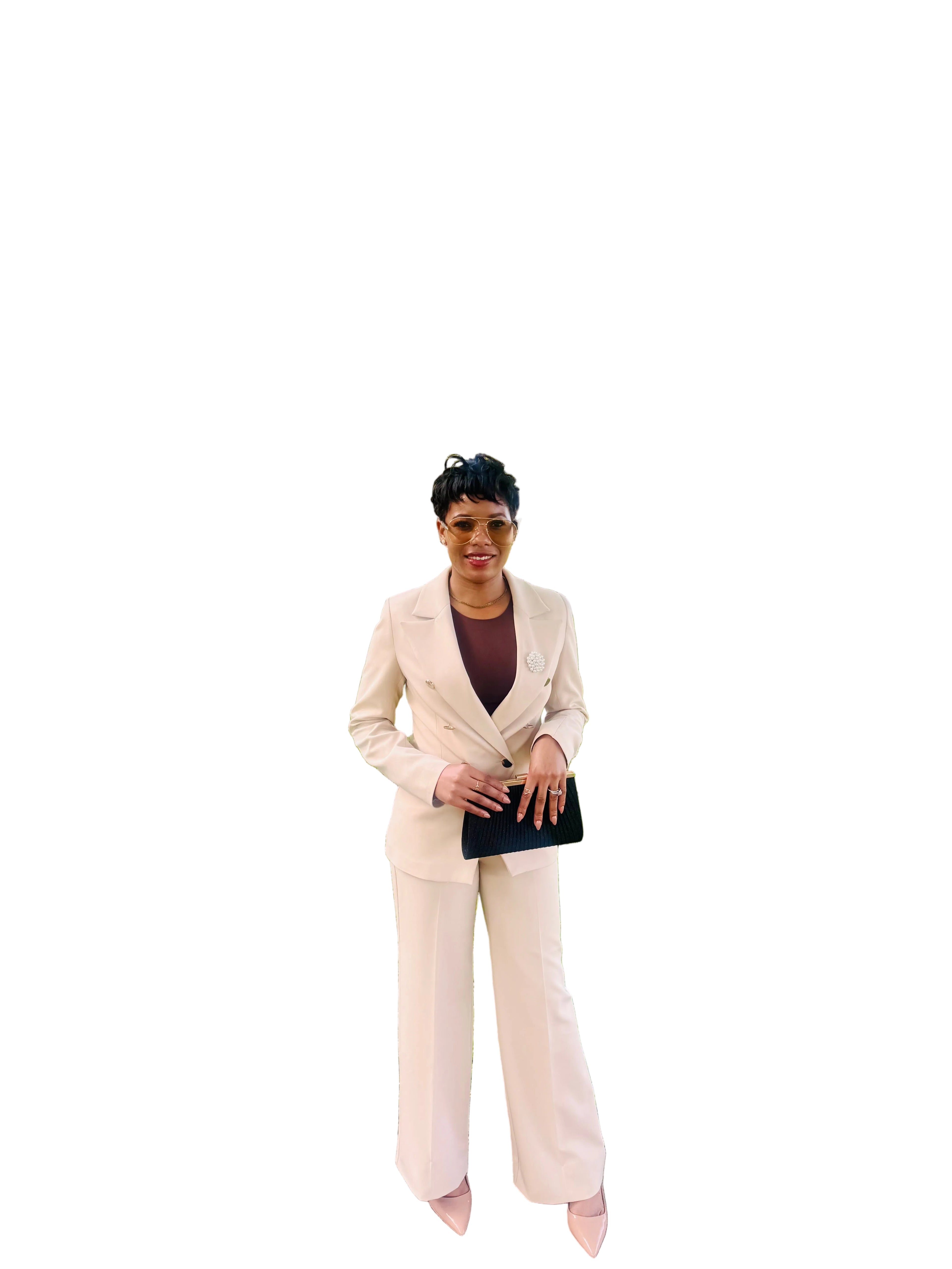 Woman wearing the Ebony Suit, an ivory double-breasted blazer and wide-leg pant set from Astine Boutik, styled for a professional daytime event